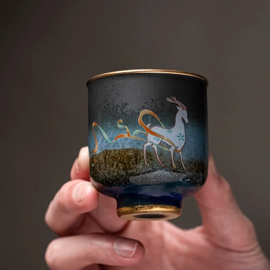 side view of style A deer motif chinese ceramic tea cup