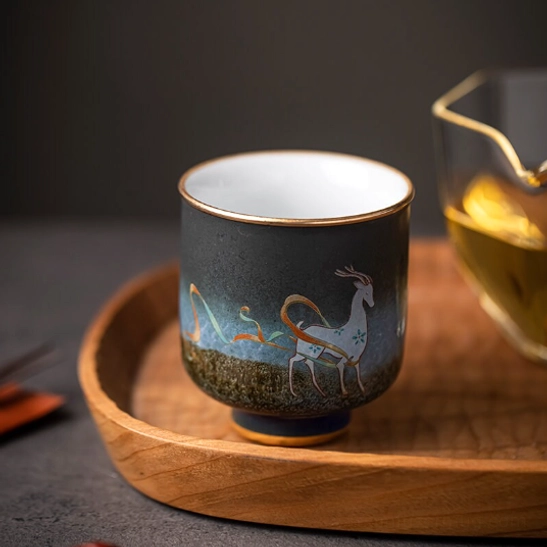 close up of deer motif on style A chinese ceramic tea cup
