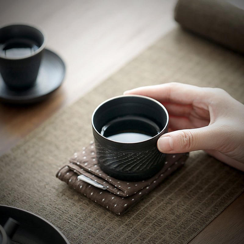 side view of style G 80ml black ceramic tea cup with silver rim