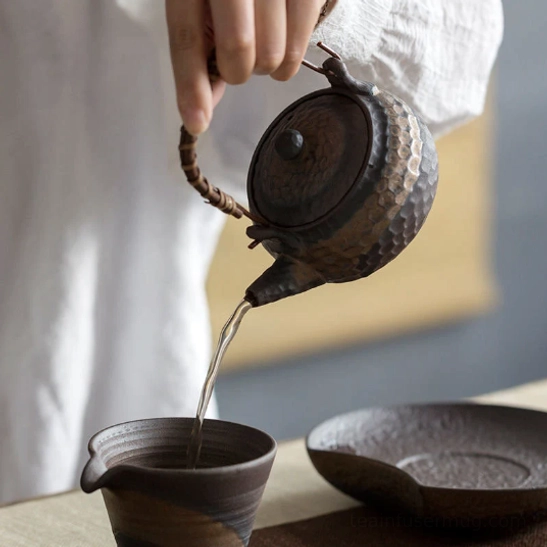 top view of teapot lid showing matching hammered texture