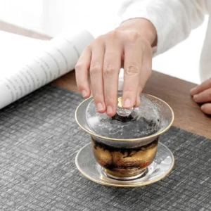 full view of textured glass gaiwan tea cup with gold rim 140ml