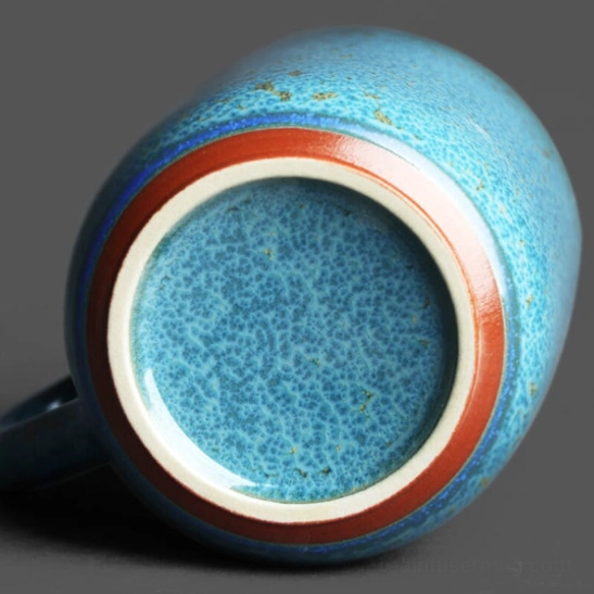 top view of assembled blue gold speckled ceramic tea infuser mug with lid