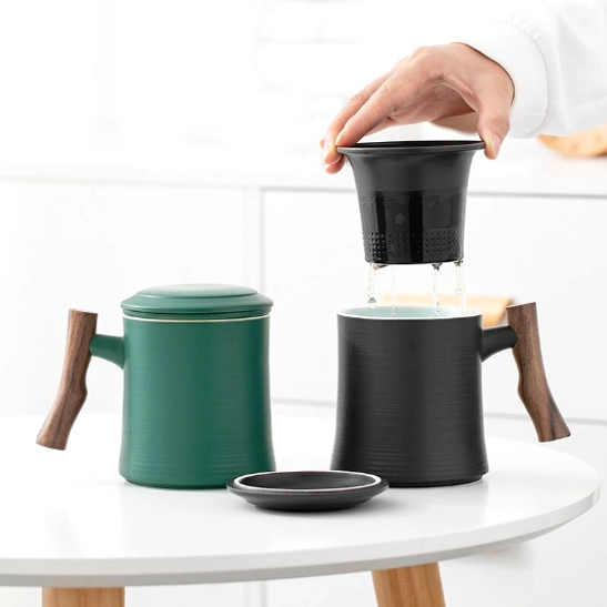 Top view of lidded ceramic tea mug with wooden handle