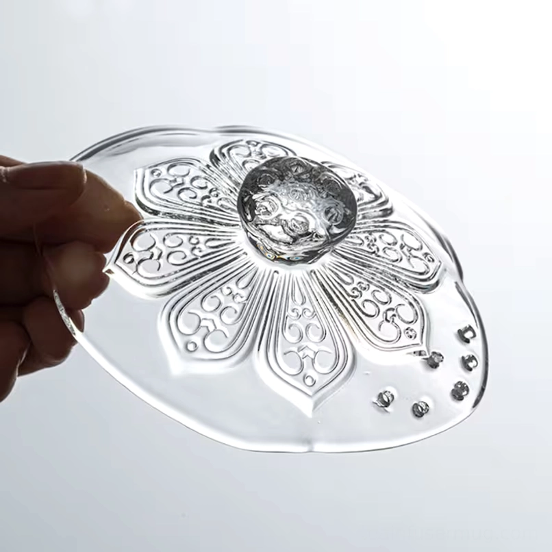 top view of embossed floral lid on glass gaiwan