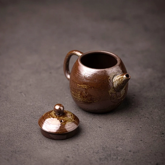 top view of japanese clay teapot showing built-in infuser opening