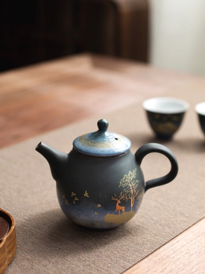 top view of open golden deer starry sky ceramic teapot