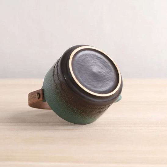 top view of gradient ceramic teapot showing open lid and stainless steel tea infuser