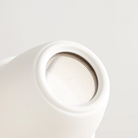 Close up of traditional Chinese frog button decoration on panda tea infuser mug sleeve