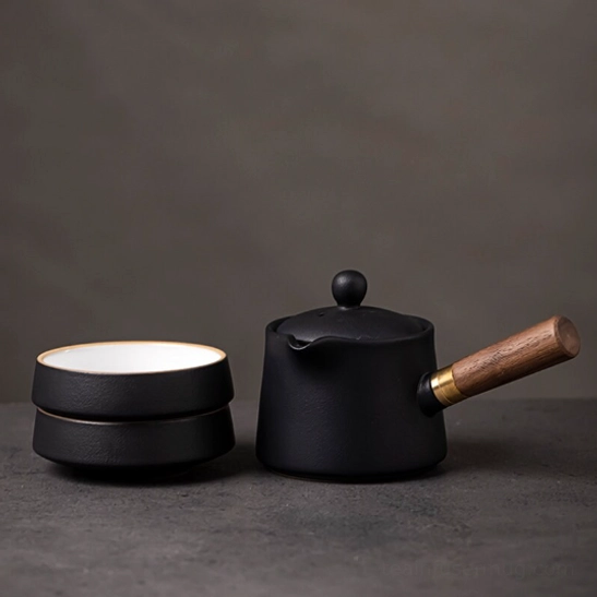 gold brass connector for travel tea set wooden handle close up