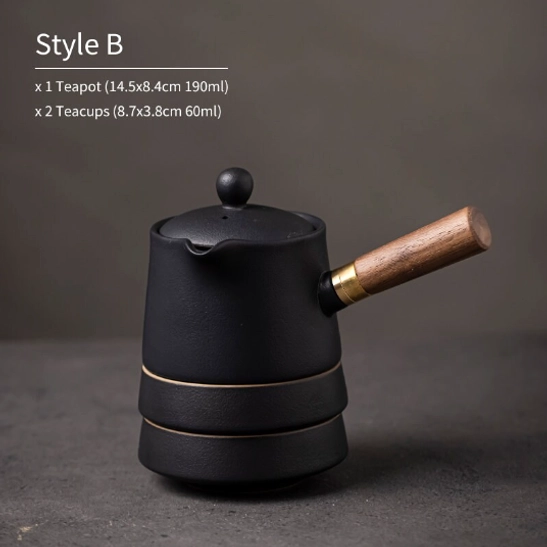 black matte ceramic travel tea set with teapot and two teacups on neutral background