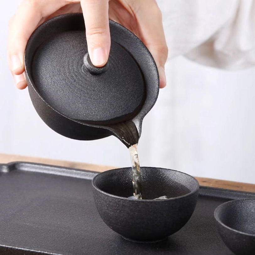 travel tea set gaiwan and teacups close up