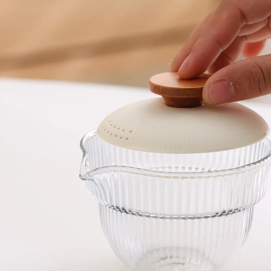 travel tea set glass gaiwan with ceramic lid and wooden knob close up