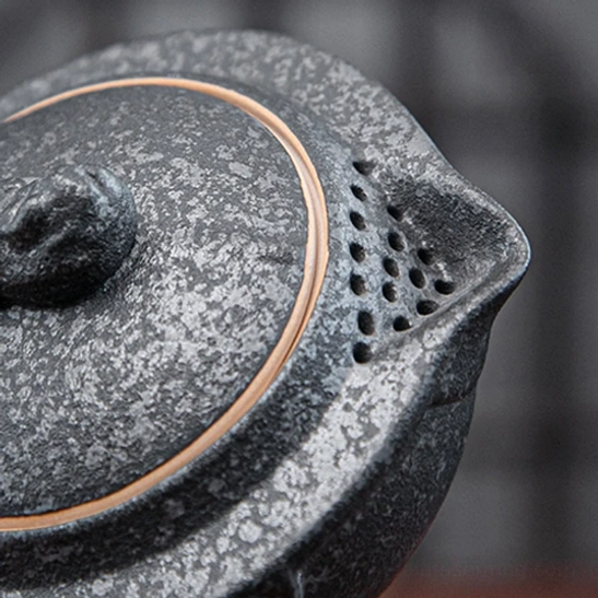 Nested travel tea set components stacked together for compact storage