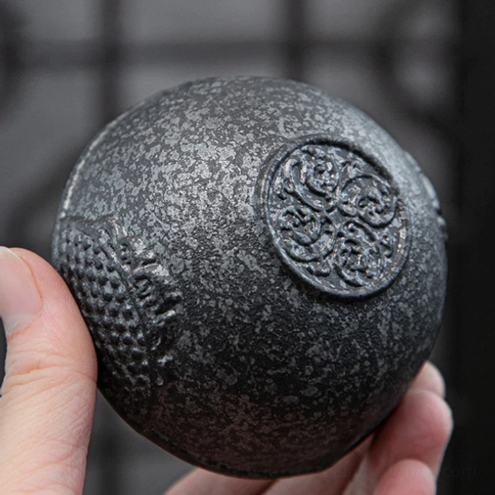 Nested travel tea set placed into protective black travel bag