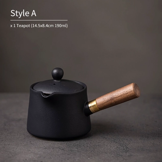 side view of black matte ceramic teapot with wooden handle travel tea set