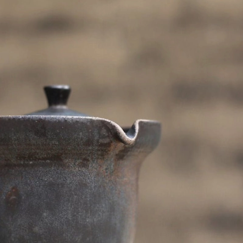 Close up of spout on travel tea set teapot