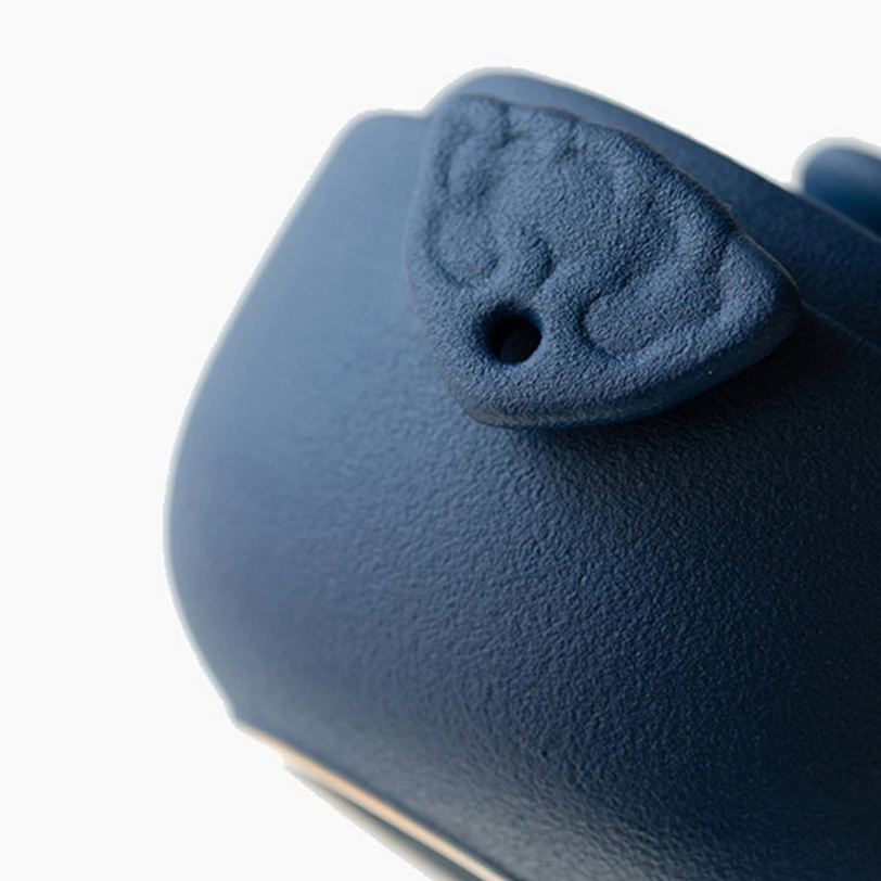 Ceramic teapot of travel tea set showing fine strainer holes at spout