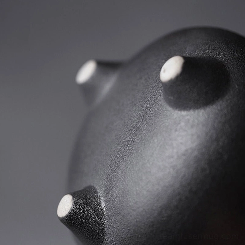 tripod base of retro ceramic teapot, bottom view