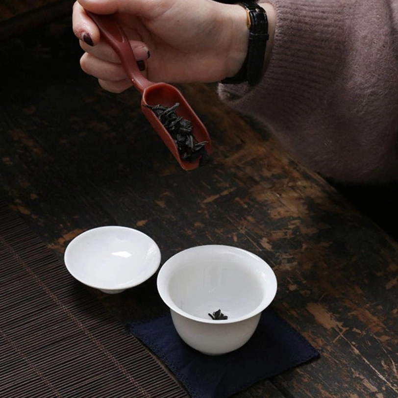 Travel tea set unboxed: gaiwan, glass pitcher and four teacups laid out