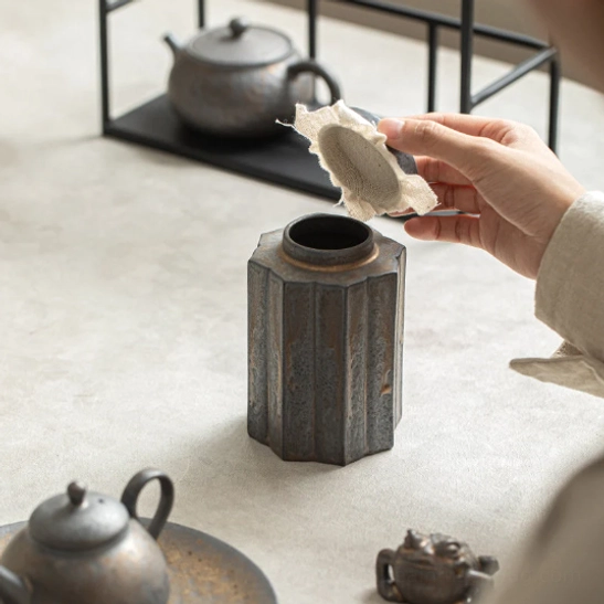 close up of fluted vertical texture on the ceramic tea canister side