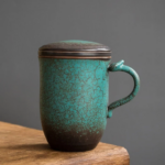 full view of vintage 15oz ceramic tea infuser mug with lid and blue green crackle glaze