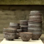 collection of vintage chinese rustic clay tea cups