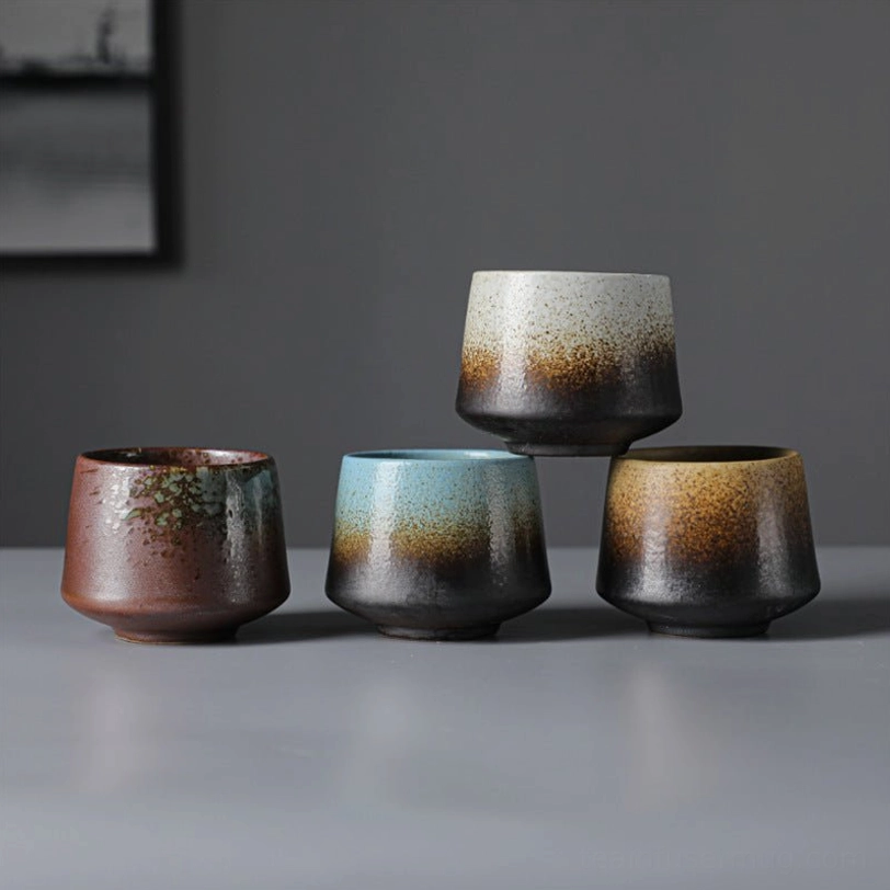 vintage chinese tea cup held in hand showing ergonomic size