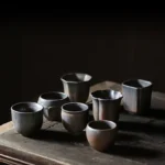 collection of vintage rustic Chinese ceramic tea cups multiple sizes