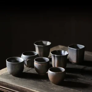 collection of vintage rustic Chinese ceramic tea cups multiple sizes