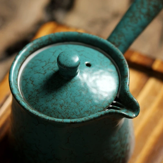 vintage crackle glaze texture on blue-green kyusu teapot