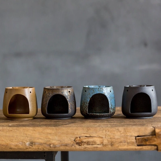 vintage glazed kyusu teapot with infuser on candle warmer