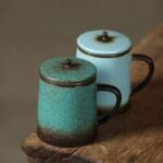 full view of vintage green ceramic tea mug with strainer and lid 390ml
