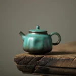 full side view of 150ml vintage green ceramic teapot with infuser