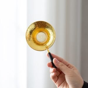 Vintage hammered brass tea strainer spoon with wooden handle full product view