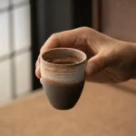 Side view of 100ml vintage Japanese clay tea cup showing natural texture
