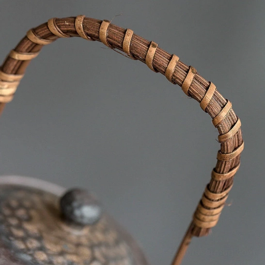 side profile of vintage 225ml wicker handle ceramic teapot