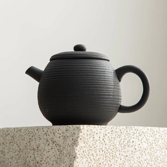 Volcanic rock clay teapot spout close up view