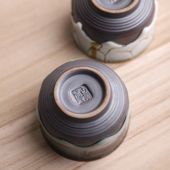 side view of wabi-sabi ceramic tea cup natural glaze texture