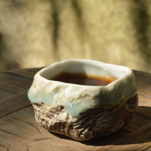 Front view of handcrafted wabi-sabi rock design ceramic tea bowl 100ml
