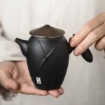 full view of 230ml wandering hero black ceramic teapot with infuser