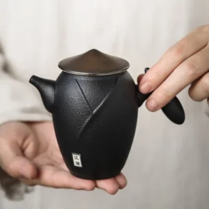 full view of 230ml wandering hero black ceramic teapot with infuser