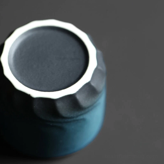 Wave embossed base detail of Chinese ceramic tea cup