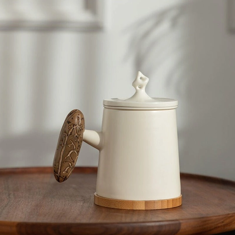 white ceramic tea infuser mug with bamboo base and removable ceramic filter