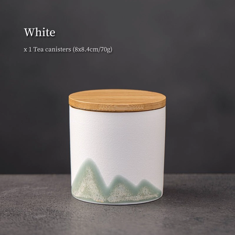 white ceramic tea storage canister with green chinese landscape art