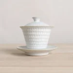 160ml white sancai gaiwan tea cup with embossed texture and gold trim full view