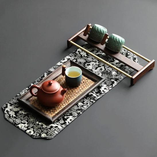 White interior glaze of ceramic tea cup with wooden handle