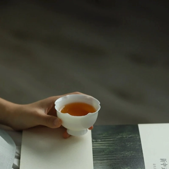 full view of 45ml white lotus petal rim chinese porcelain tea cup