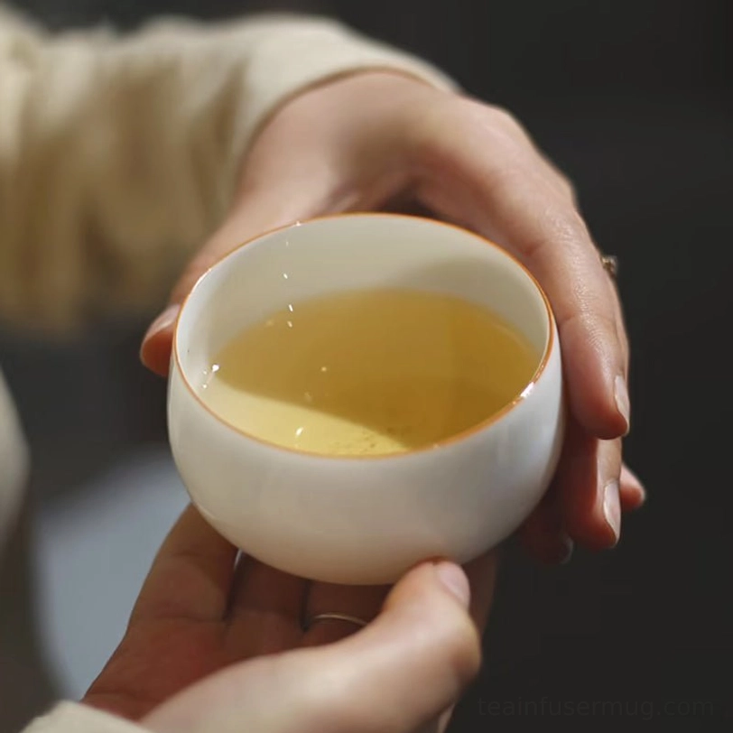 white porcelain gongfu chinese tea cup side view with gold rim