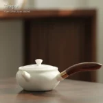 full side view of 180ml white porcelain kyusu teapot with wooden side handle