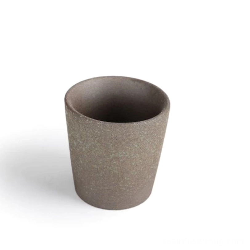 white speckled chinese clay tea cup close up texture view